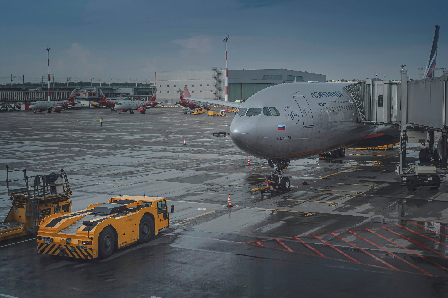 a truck next to an airplane