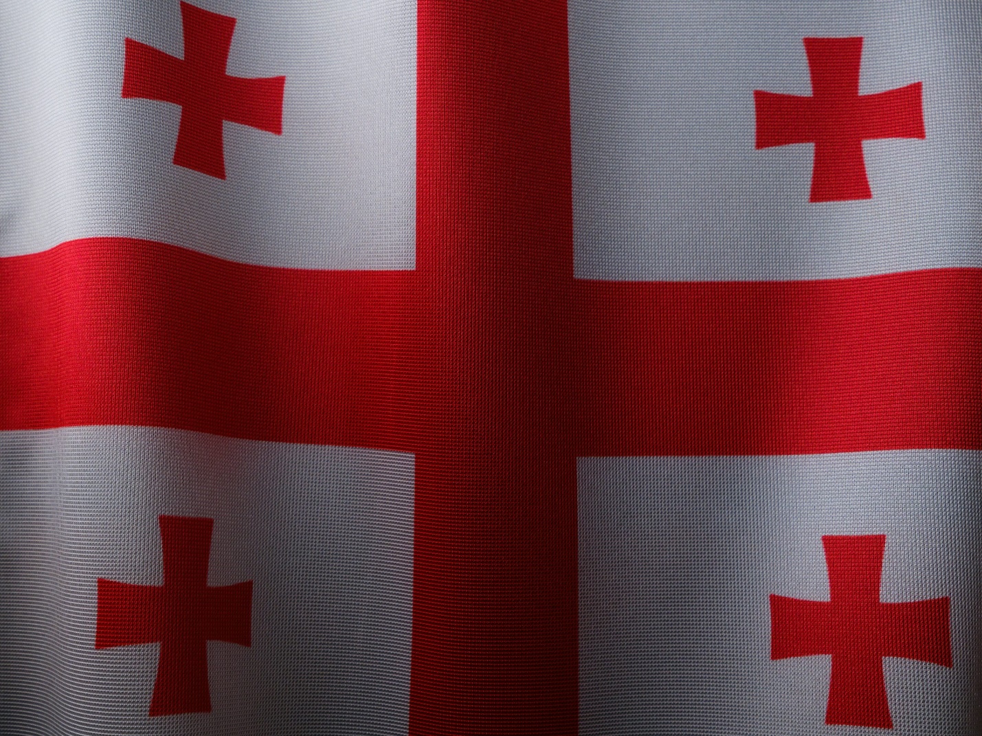 a red and white flag with a cross on it