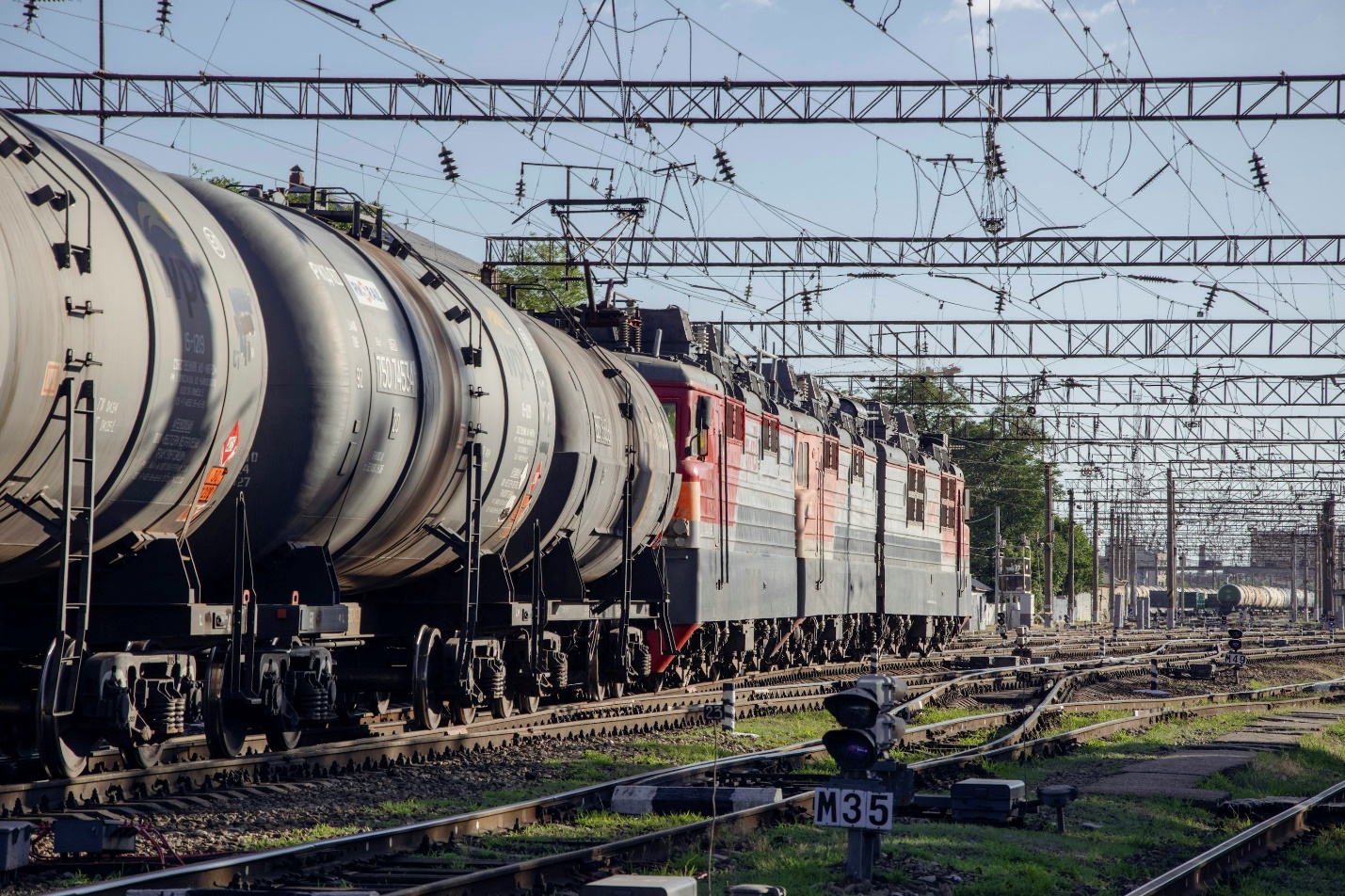 A train on a train track with a sky background